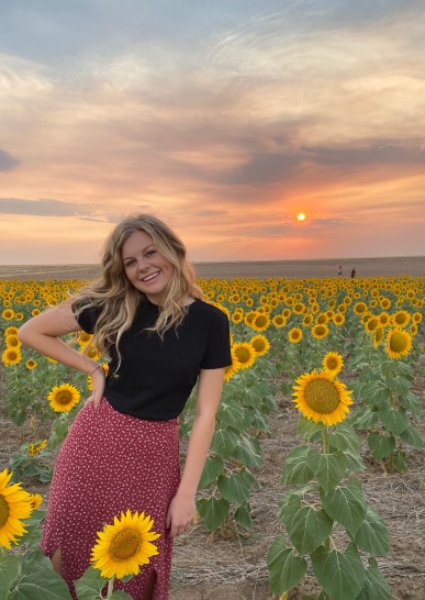 Girl In Sunflower Field