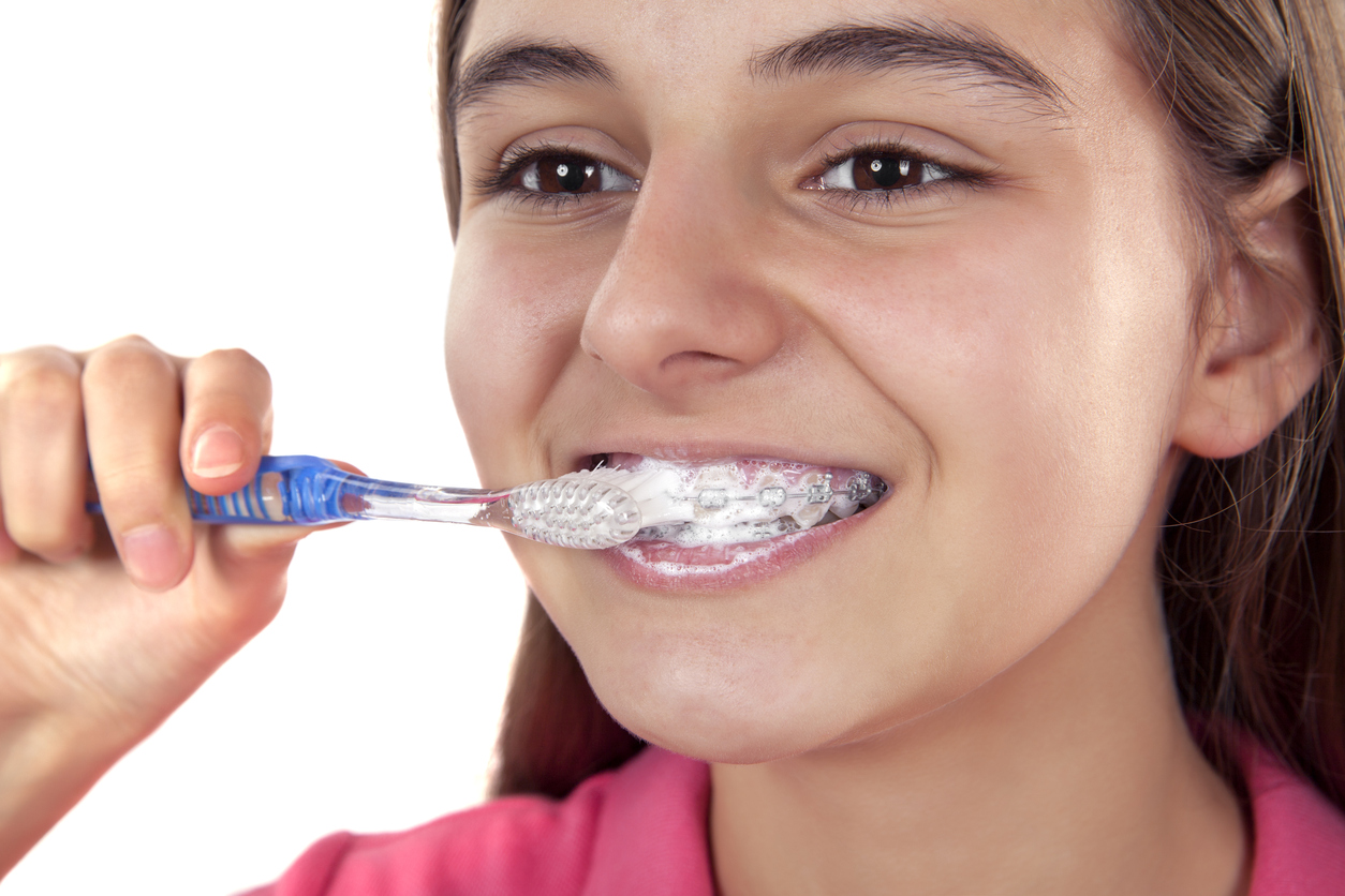 Tooth brush braces young girl