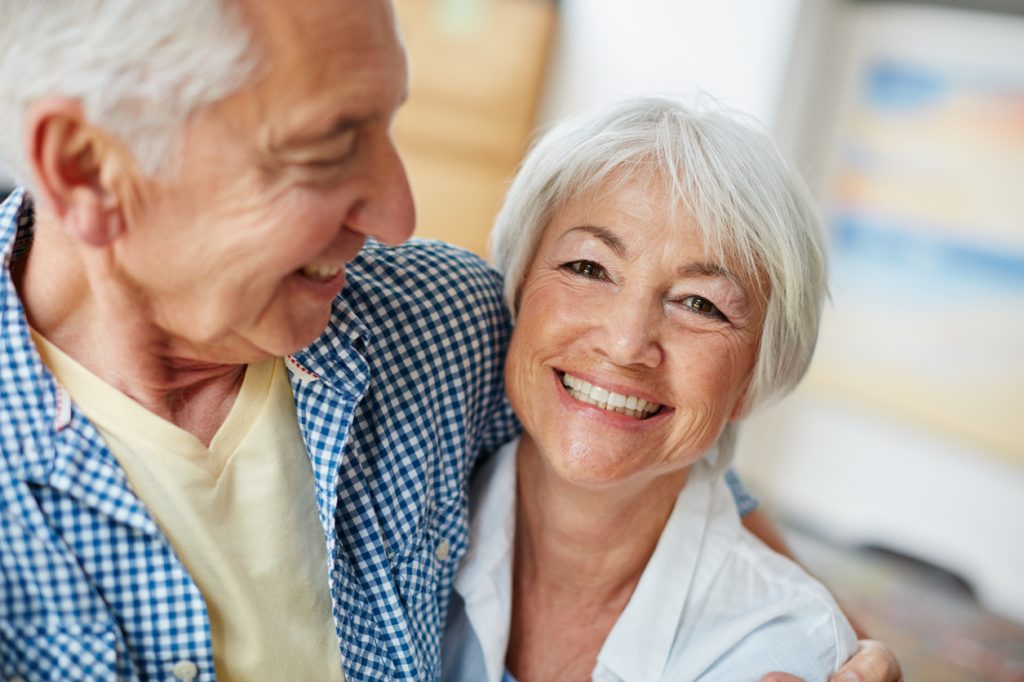 Elderly couple embracing