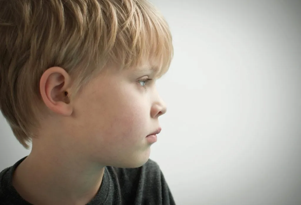 Young boy looking off camera