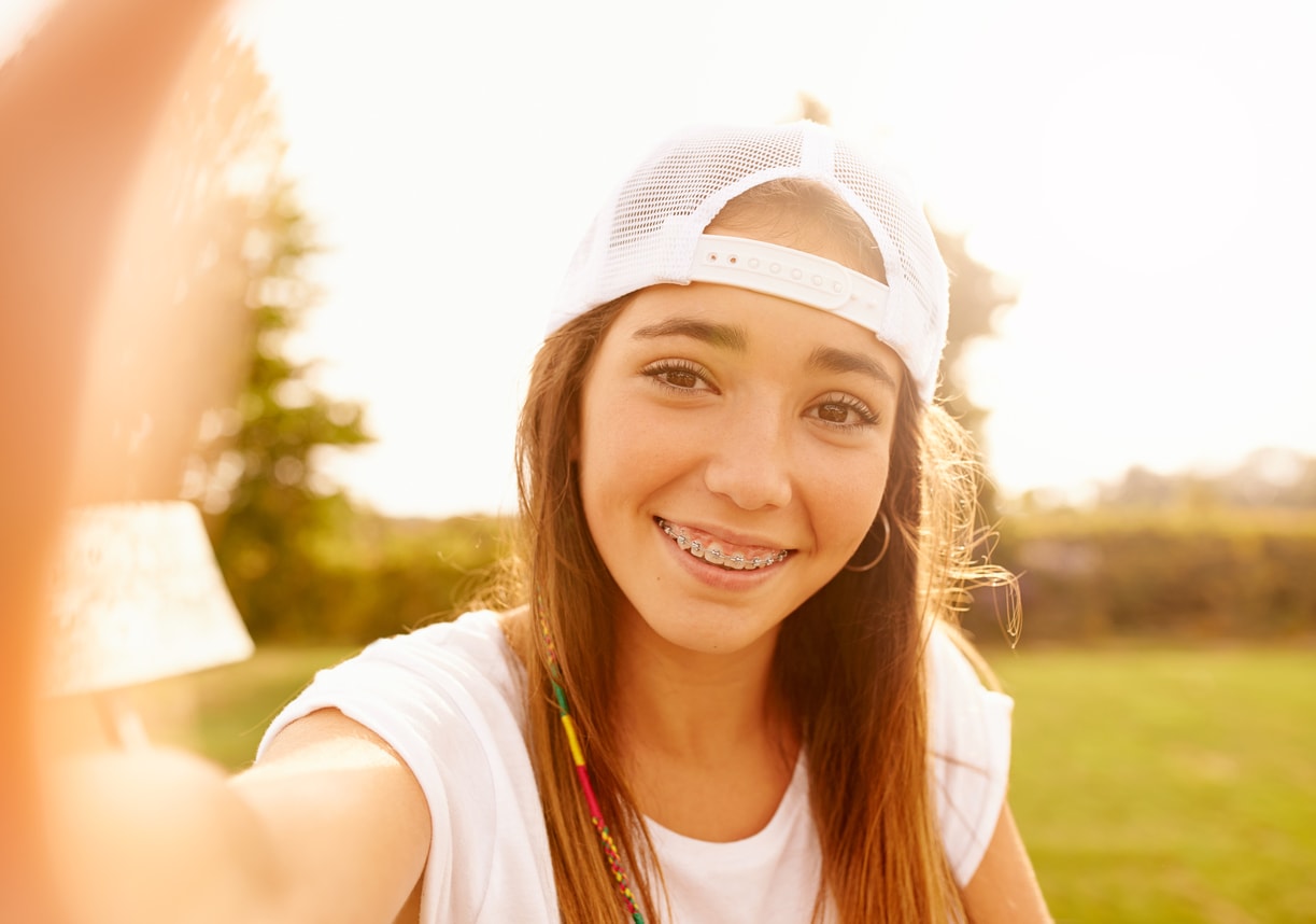 Teenage girl looking at camera and smiling