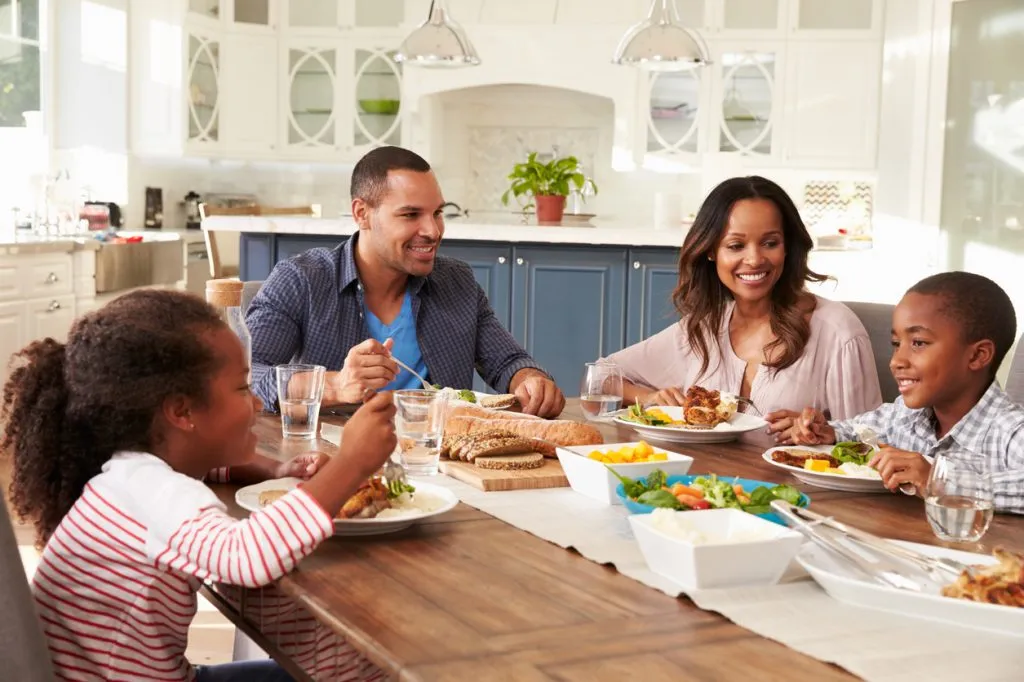 Family of four eating a healthy dinner