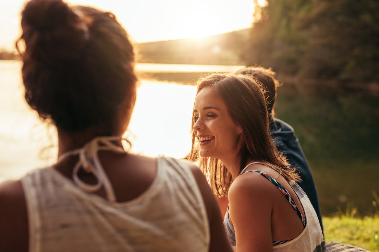 Young adult smiling with friends