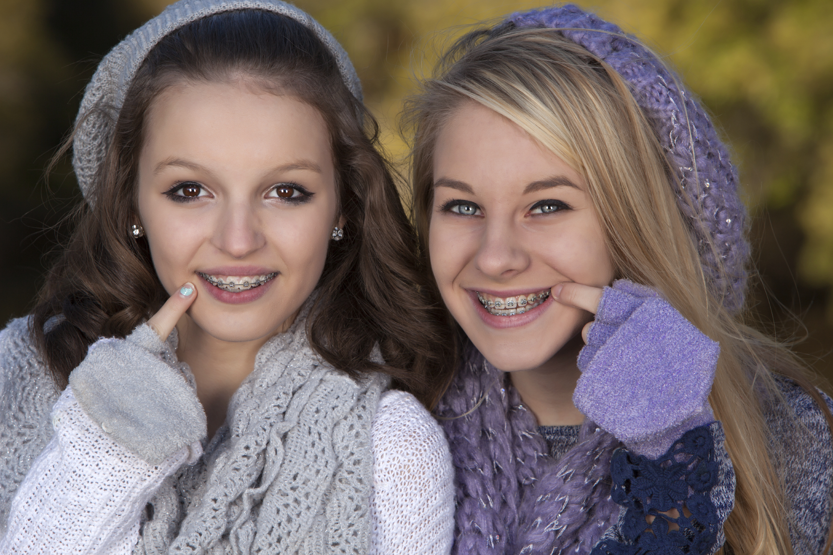 Two girls dressed up with braces